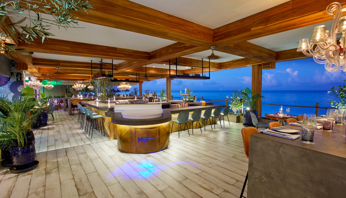 a large bar with chairs and a large ceiling